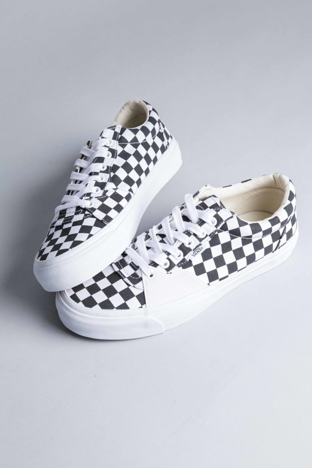 black and white low top vans checkered